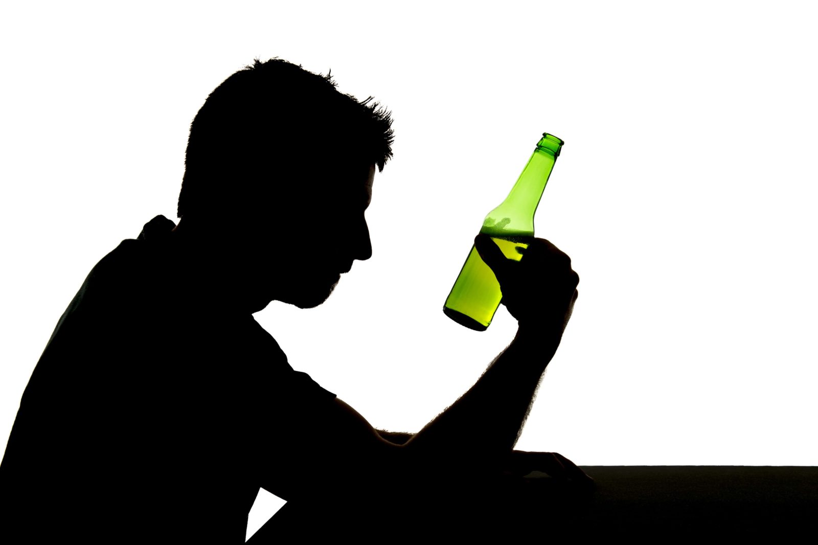 silhouette of alcoholic drunk young man drinking and holding beer bottle feeling sad and depressed suffering alcohol addiction and alcoholism problem isolated on white background