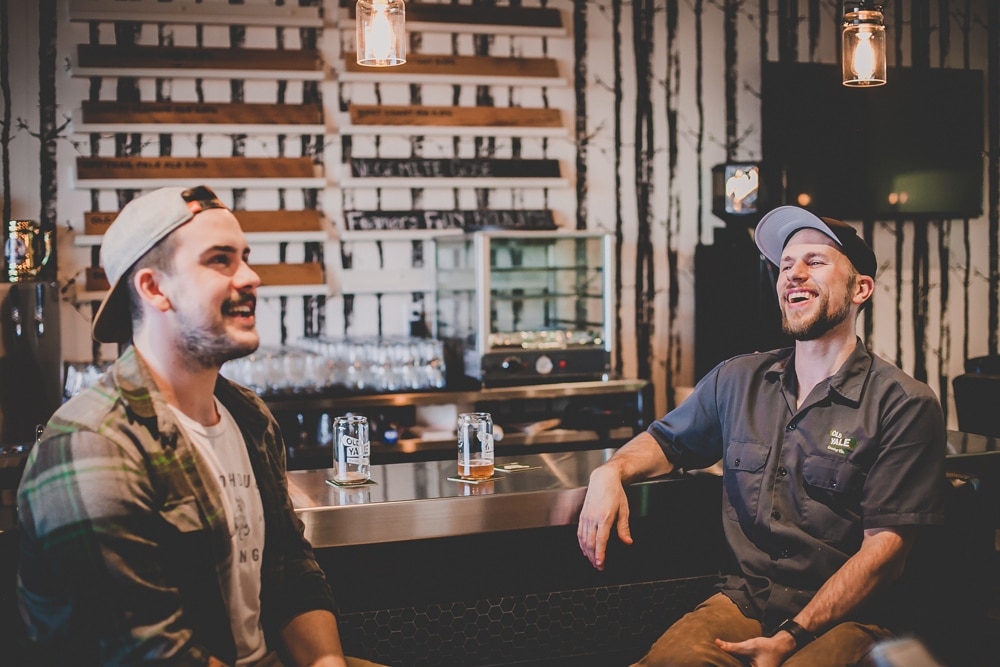 Fellow Aussies Josh McGrogan (left) of Field House Brewing and Mike Roberts of Old Yale Brewing Co. (right) share a laugh and a pint at Old Yale's new tasting room. Lou Lou Childs photo
